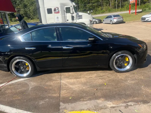 Black sedan outside Redline Auto Detailing