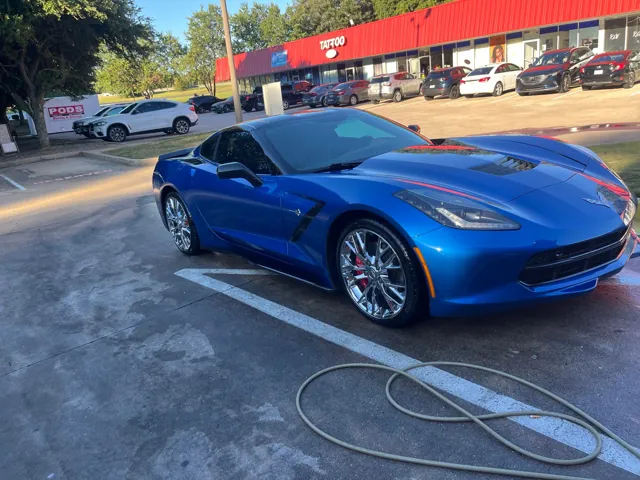Blue Chevrolet Corvette outside Redline Auto Detailing
