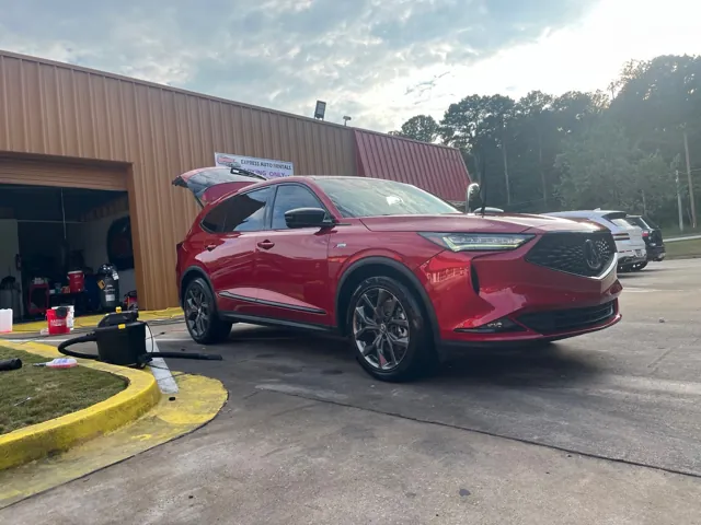 Red SUV outside the Redline detailing shop